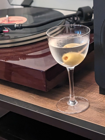a martini next to a turntable