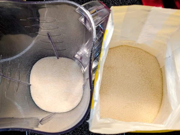 The inside of a bag of sugar on the right is compared to blended sugar on the left.