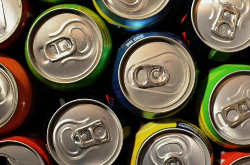an overhead photograph of unopened soda cans