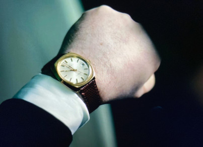an image of a back of somebody's hand with a wristwatch reading ten o'clock