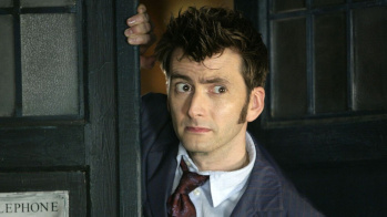 David Tennant as the tenth iteration of the Doctor from Doctor Who peering out from inside the TARDIS