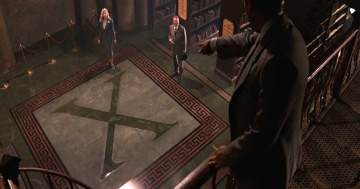 a still image from the part of the movie I just mentioned where Indy is pointing down to an X on the floor